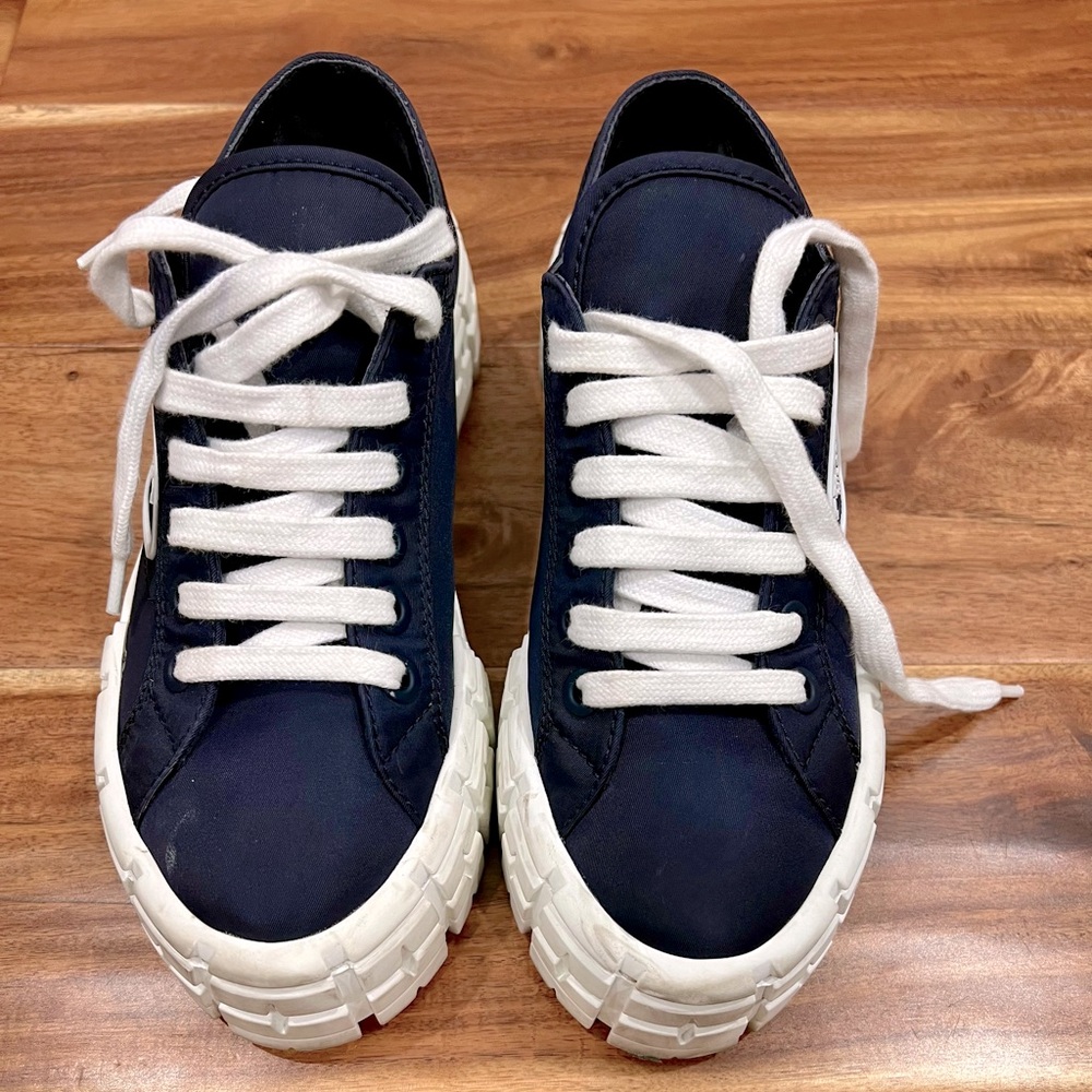 Nylon Prada Platform Sneakers Size 8 but runs small that’s why hardly wore them.